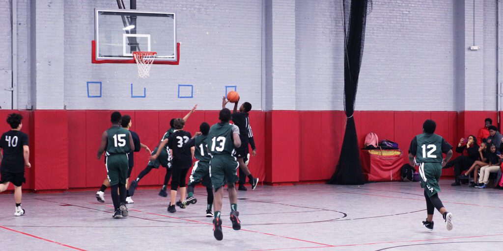 OCP basketball team playing in a game against another school.